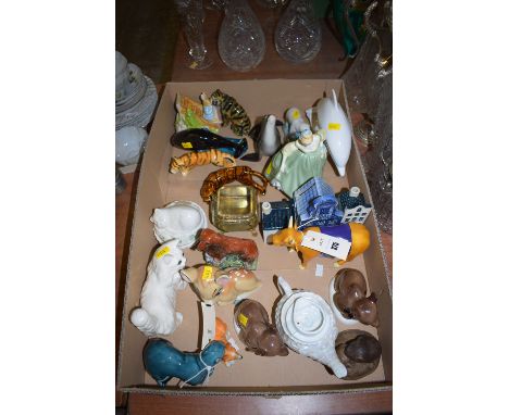 A box of collectable ceramics, including: a Beswick cat; two Russian bears; a Poole dolphin; a Poole seal; a Belleek cat on b