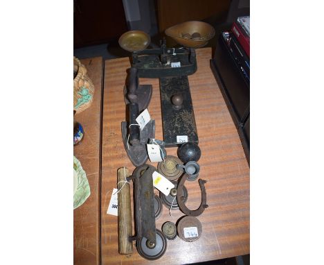 A pair of scales with weights; two irons; etc.