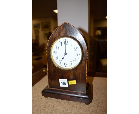 An Edwardian inlaid mahogany mantel clock with enamel dial.