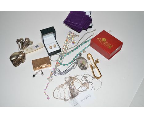 A quantity of costume jewellery including necklaces and earrings, etc; together with a DuPont lighter; three silver teaspoons