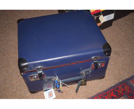 A "Globe-Trotter'' travelling trunk, in blue.