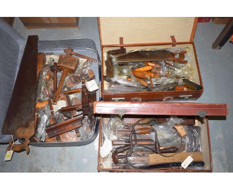 A large collection of woodworking tools, in three suitcases, to include: moulding planes and other planes; chisels; saws; woo