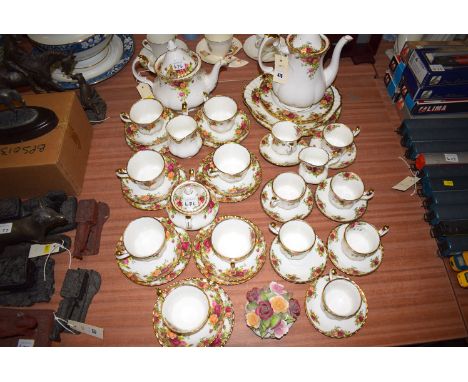 A Royal Albert "Old Country Roses" pattern part tea and coffee service; together with an 'Old Country Rose' flower ornament.