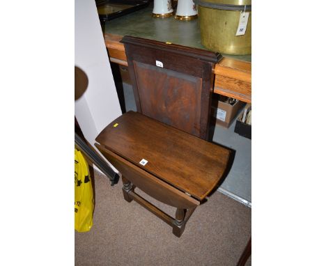 An oak drop leaf circular occasional table with turned legs; and a mahogany firescreen.