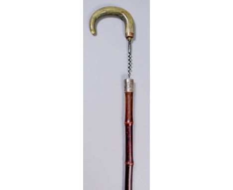 A 19th Century novelty walking stick with bamboo shaft, the horn handle unscrewing to reveal a steel corkscrew, mounted with 