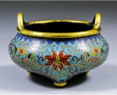 A Chinese Imperial cloisonné enamel tripod censer of compressed two-handled lobed form, decorated in the "Ming" style with a 