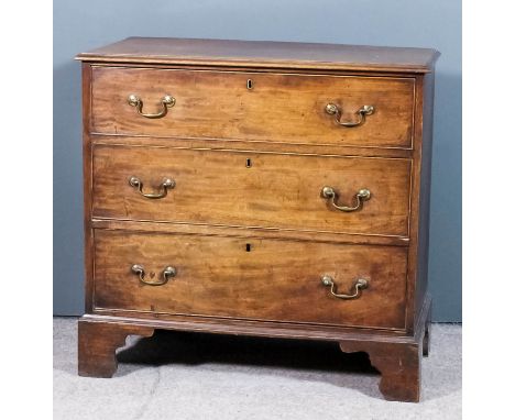 A George III mahogany chest with moulded edge to top, fitted three long drawers, on bracket feet, 35.5ins wide x 18.5ins deep