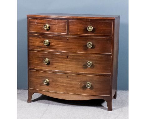 A George III mahogany bow front chest with reeded edge to top, fitted two short and three long drawer, on shaped apron and sp