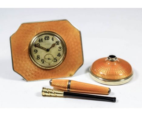 An early 20th Century silver and orange enamel cased desk timepiece, retailed by W. Allemann of Montreux, the 1.5ins diameter