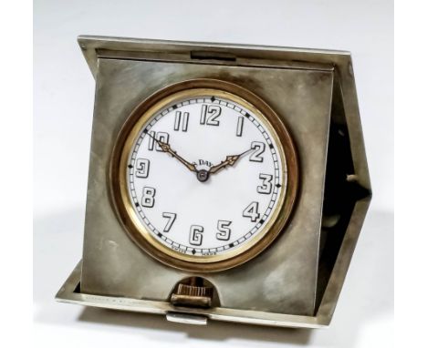 A George V silver cased travelling timepiece, the 2.25ins white enamel dial with Arabic numerals, to the eight day timepiece 