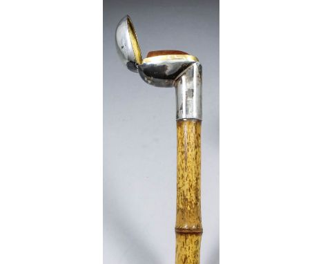 An early 20th Century novelty silver mounted bamboo walking stick, the hinged silver mount lifting to reveal a concealed smok