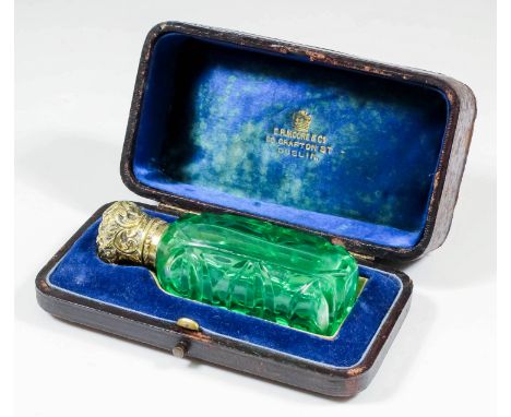 A Victorian silver gilt metal mounted and green glass rectangular scent bottle with panel cut front and back and slice cut si