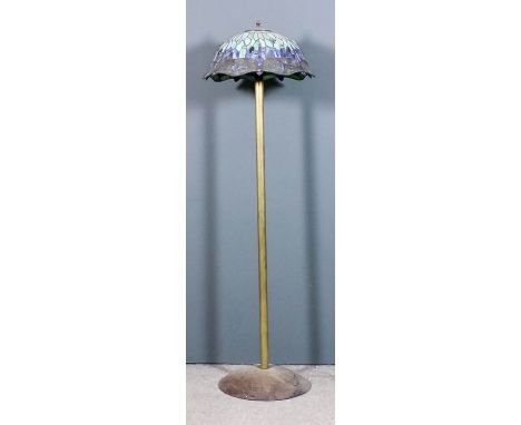 A brass electric standard lamp with plain column and on circular domed base, 68ins high, and shade for same