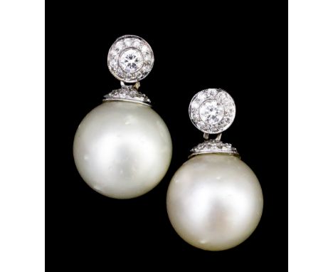 A pair of modern 18ct white gold mounted pearl and diamond set earrings (for pierced ears), the 14.6mm diameter pearl suspend