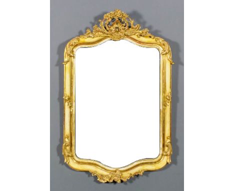 A French gilt and cream painted rectangular wall mirror of "Louis XV" design, the shaped and moulded frame with bold fretted 