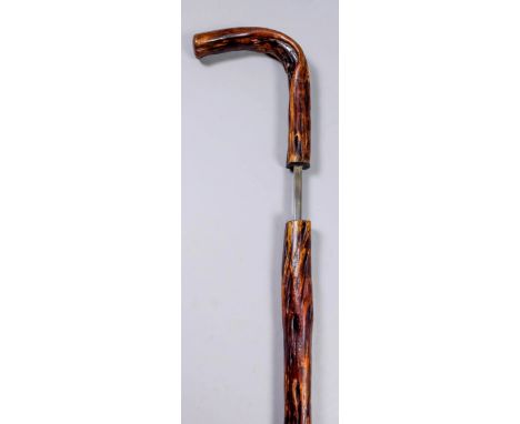 A 19th Century composite walking stick sword stick with briar shaft, the 22.75ins square steel blade unmarked, 36ins overall 