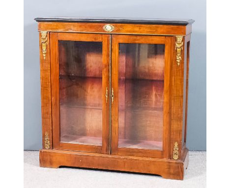 A late Victorian walnut and gilt metal mounted dwarf display cabinet with moulded ebonised edge to top, the whole inlaid with