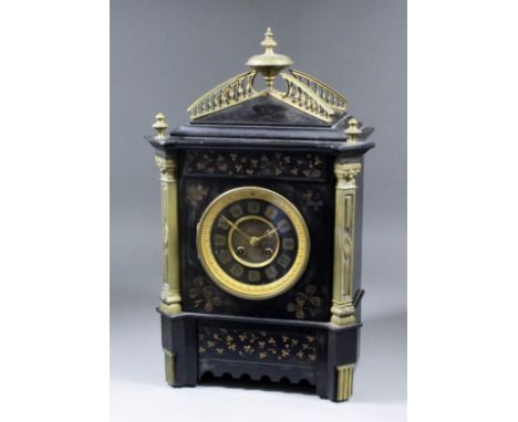 A late 19th Century French mantel clock, No. 9322 64, the 4.5ins black enamelled metal dial with Roman numerals in shaped car