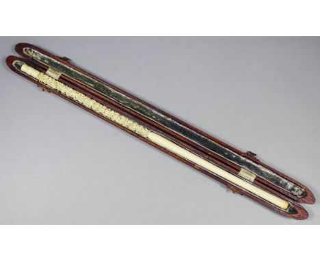 A Chinese ivory cigarette/cheroot holder, the upper part deeply carved with dragons chasing the sacred ball, the end turned, 