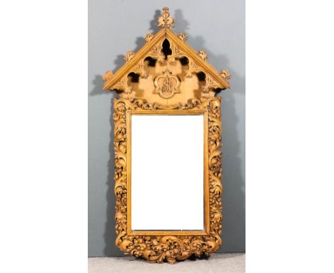 A Victorian carved oak framed church notice board with pointed arched top, carved fleur de lis cresting and carved Gothic sty