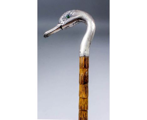 An early 20th Century silver "swans head" pattern walking stick, the handle modelled as a swan head, London 1907, on bamboo s