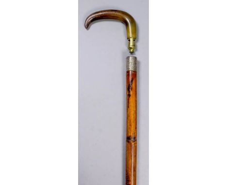 A 19th Century novelty walking stick, the cane shaft with engraved silver band, Birmingham 1889, with horn handle unscrewing 