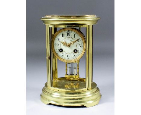 An early 20th Century French brass oval "Four Glass" mantel clock by Japys Freres, No. 2875 3 11, and retailed by Davies Son,