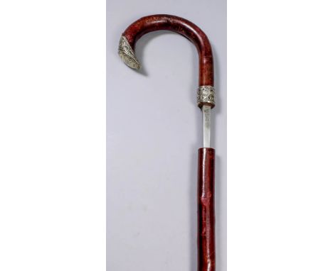 A late 19th Century composite walking stick sword stick with rustic shaft, the 27.75ins square section steel blade stamped "N