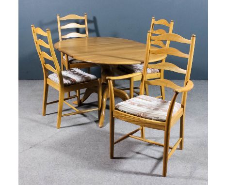 A modern Ercol blonde elm "Penn" design oval extending dining table, with one extra leaf, on baluster turned central column a