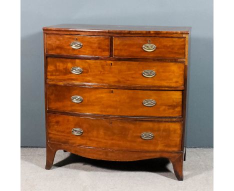 A George III mahogany bow front chest, the top inlaid with crossbandings and stringings, fitted two short and three long draw