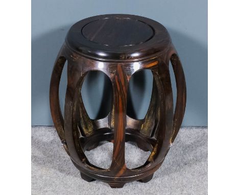 A Chinese hardwood barrel-shaped stool with flush panel to top, on eight bowed supports and bracket feet, 11ins (28cm) diamet