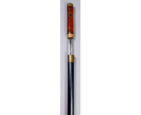 A 19th Century composite walking cane sword stick with ebony shaft, the 26.5ins steel blade unmarked, the lighter hardwood ha