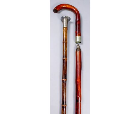 An early 20th Century novelty walking cane, the bamboo shaft with engraved silver collar for London 1907, with circular plate