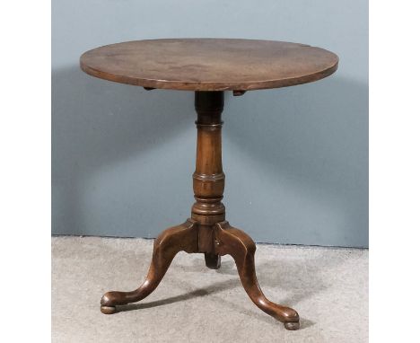 An 18th Century mahogany circular tripod occasional table with plain one piece top, on turned central column and cabriole leg