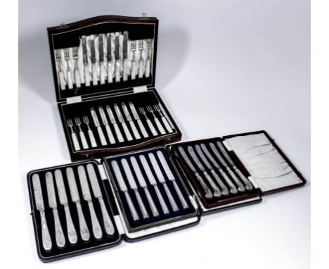 A set of twelve George V silver and mother-of-pearl handled fruit knives and forks by Cooper Brothers & Sons Ltd, Sheffield 1