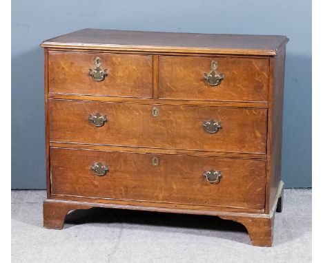 A late Georgian oak chest with moulded edge to top, fitted two short and two long drawers, on bracket feet, 37ins wide x 20in
