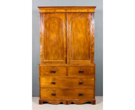 A Victorian gentleman's mahogany wardrobe, the upper part with moulded cornice, fitted four sliding trays enclosed by a pair 