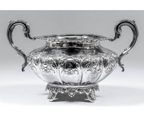 A Victorian silver circular two-handled sugar basin of bulbous squat form, with shell and leaf pattern mounts, the body embos