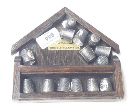 Set of enamel EPNS thimbles and a Charles Horner silver thimble 