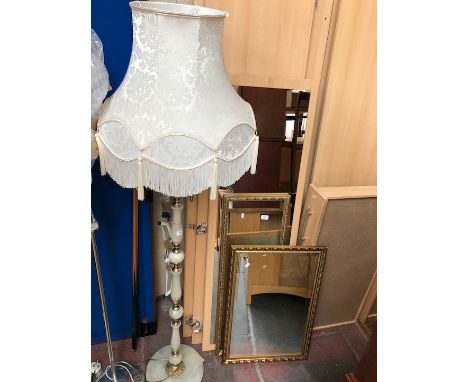 An onyx and brass effect standard lamp 