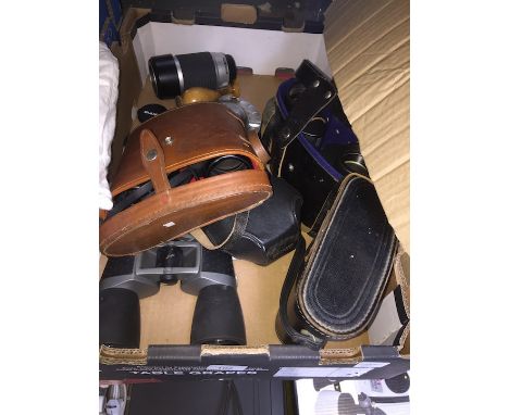 A box of cameras and binoculars to include Beirette Electronic camera, Tokina AF lense, etc 