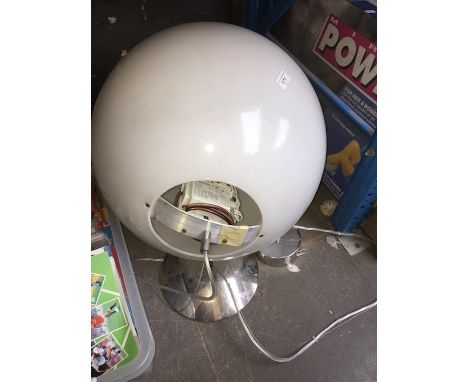 A large globe shaped ceiling light 
