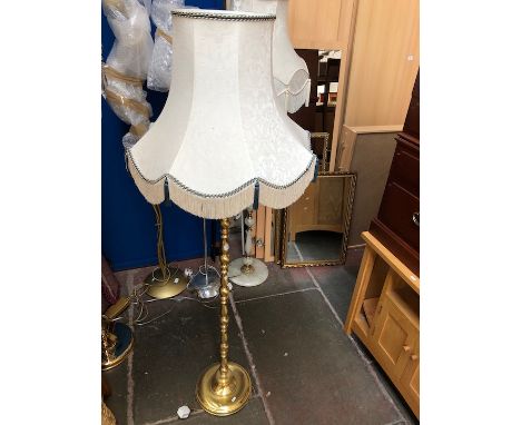 A brass effect standard lamp 