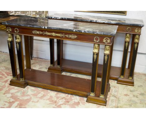 CONSOLE TABLES, a pair, Empire style mahogany, ebonised and brass mounted with marble tops on front pillar supports, 82cm H x