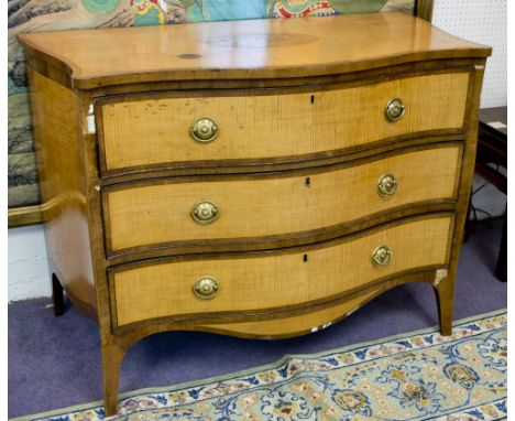 SERPENTINE COMMODE, George III satinwood and crossbanded, circa 1770, with inlaid oval top above three drawers with later bra
