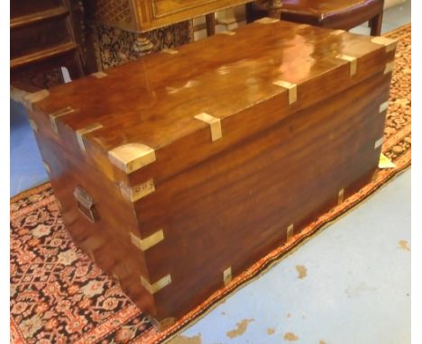 TRUNK, 19th century Camphorwood and brass bound with rising lid and carrying handles, 54cm H x 104cm W x 58cm D.