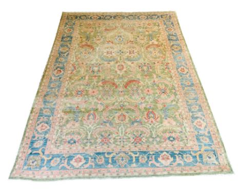 FEREHAN ZIEGLER CARPET, 320cm x 220cm, all over palmette and foliage design on a jade field within an aqua marine repeat palm