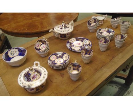 STAFFORDSHIRE PART TEA SERVICE, c.1825-30, comprising eleven tea cups, eleven coffee cups, twelve saucers, teapot, two servin