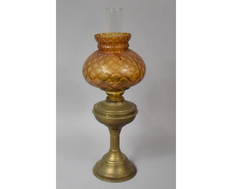 A Brass Oil Lamp with Amber Glass Shade, Double Controls, 55cm high 