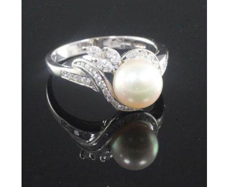 An Italian 18ct white gold, cultured pearl and diamond cluster ring, the pearl with a diamond set foliate scroll border and d